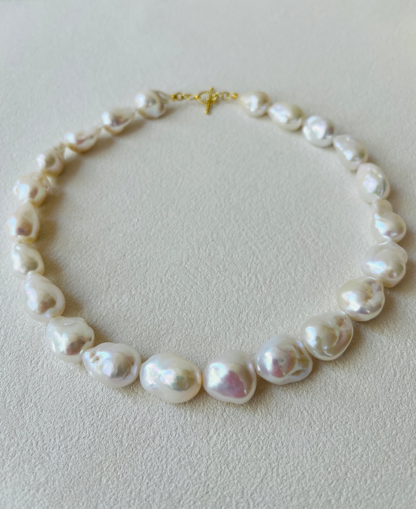 Baroque Pearl necklace on a light gray background